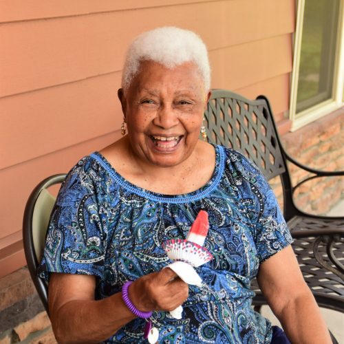 Senior woman on porch with popsicle