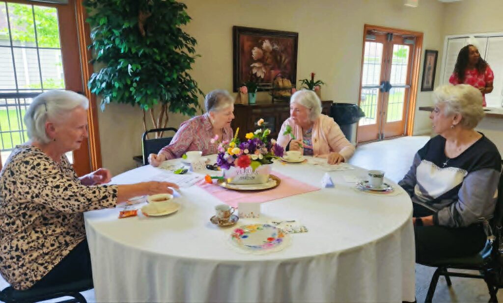 Good Shepherd Community residents enjoying a tea party to celebrate Mothers' Day