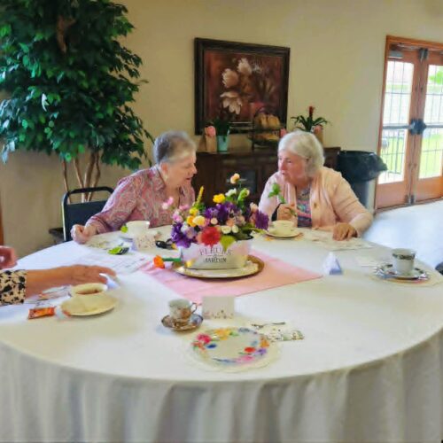 Good Shepherd Community residents enjoying a tea party to celebrate Mothers' Day